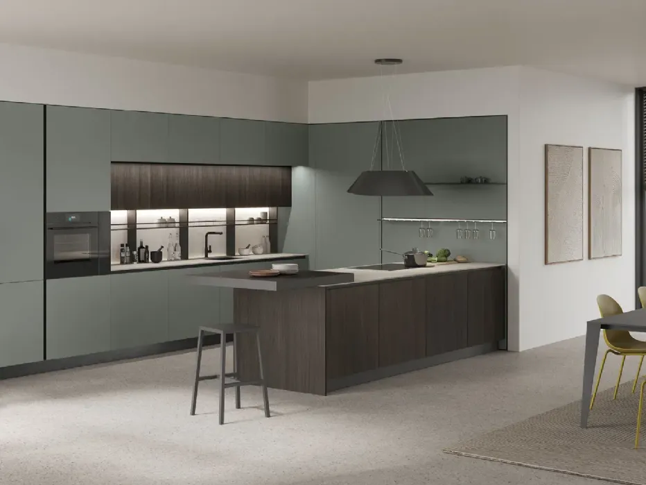 An open space for those who don't want to overcomplicate their lives: from the dining area you go to the kitchen, from the kitchen to the living room and vice versa. Moka and Giada oak, Sapienstone Light Grey countertop.
